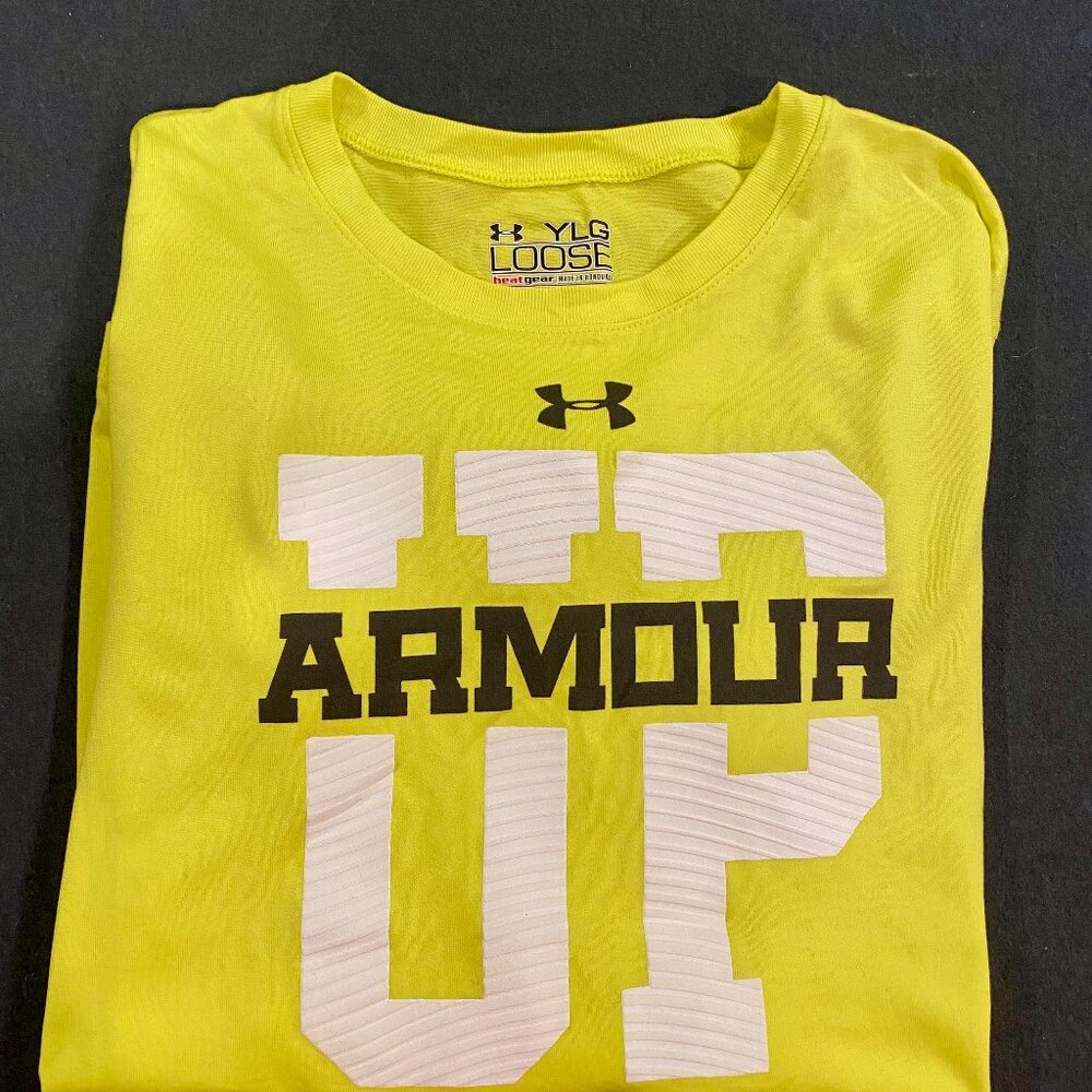 Under Armour Heat Gear. Loose fitting; boys large.  Yellow